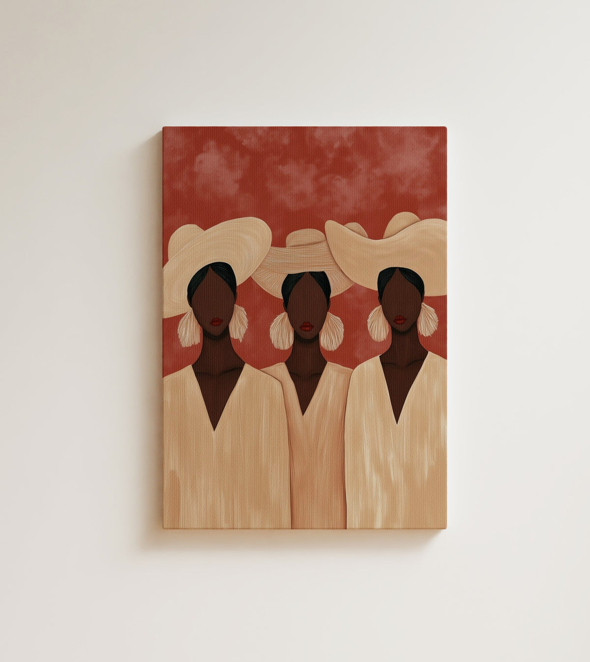 Summer Trio: three Black women in wide straw hats and cream dresses stand against a terracotta sky. Canvas wall art, shown on a plain wall