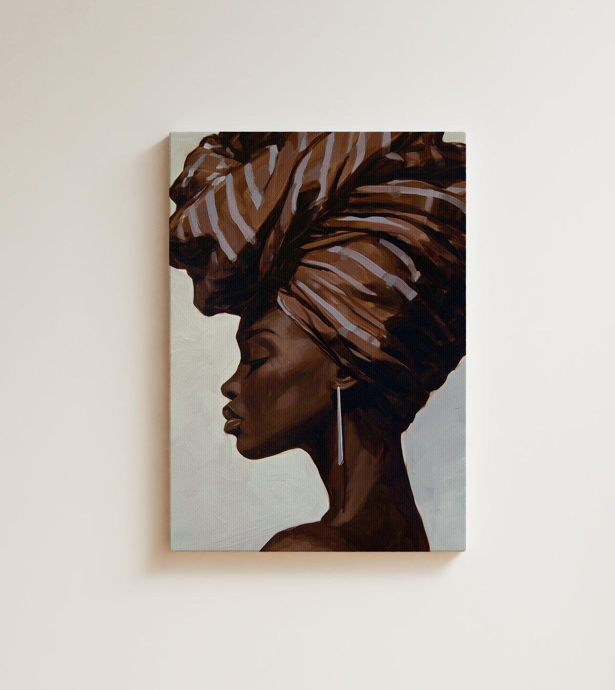 Profile in Umber: eyes closed, chin lifted, the wrap tied like a crown. Canvas wall art, shown on a plain wall