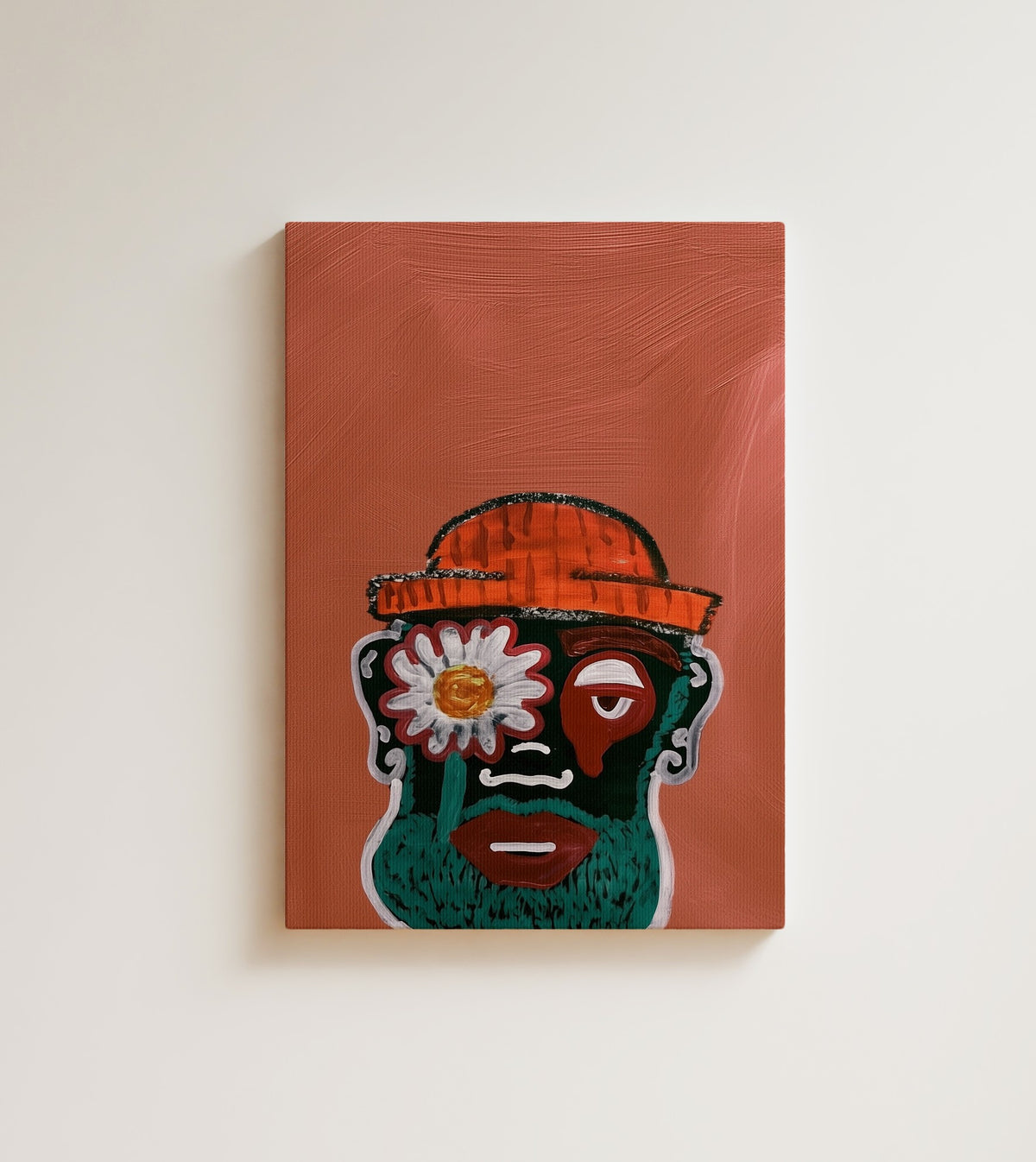 The Mask: A Black man's face becomes a folk mask in teal, red and green. Canvas wall art, shown on a plain wall