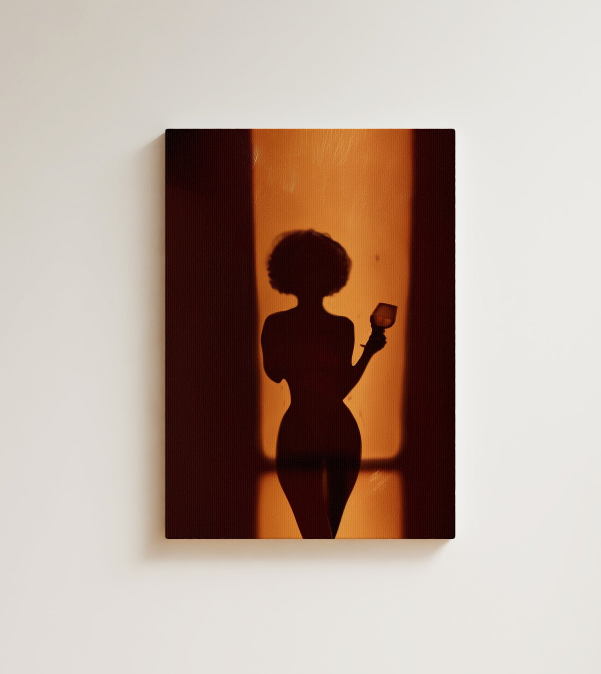 Silhouette at the Door: A woman's silhouette behind a warm amber wall of light, her afro haloed in burnt orange. Canvas wall art, shown on a plain wall
