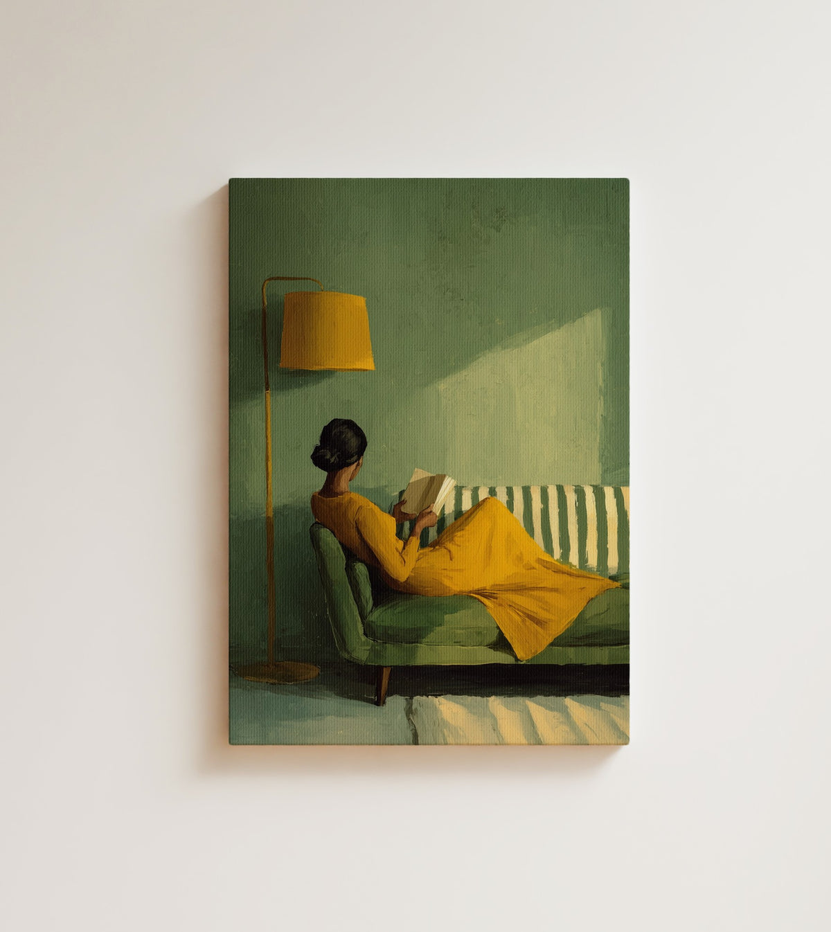 Reader in Yellow: A quiet afternoon that belongs entirely to her, a Black woman curled into a green sofa with a book. Canvas wall art, shown on a plain wall