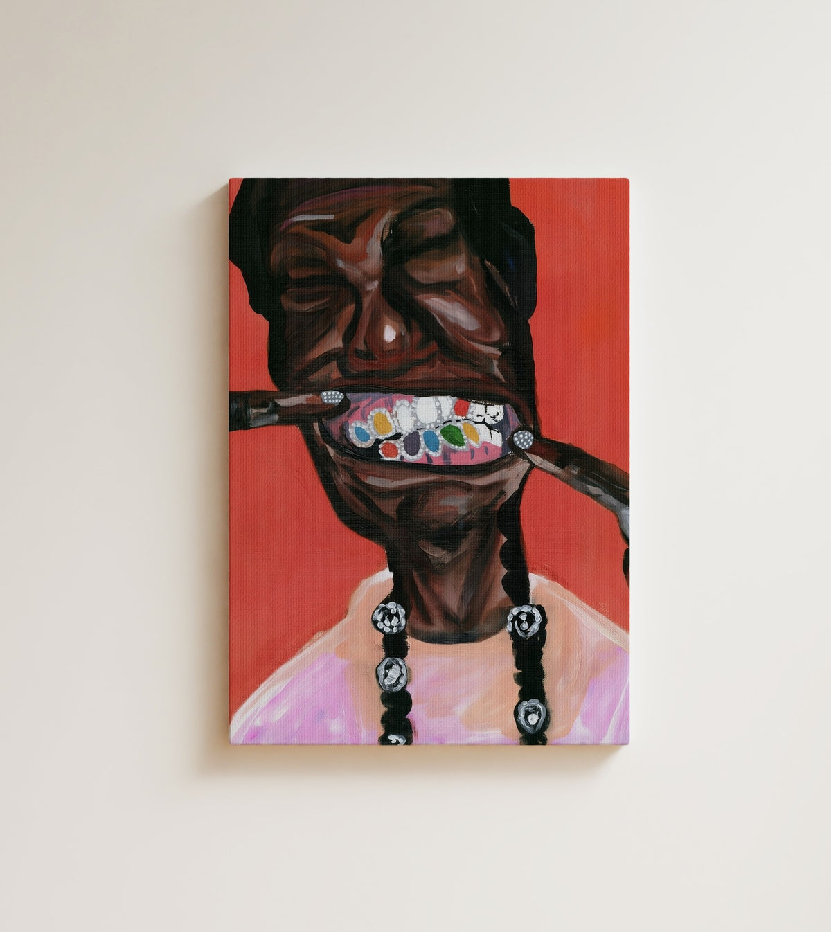 The Grin: A Black man grins wide, showing a colorful jeweled grill and long beaded braids. Canvas wall art, shown on a plain wall