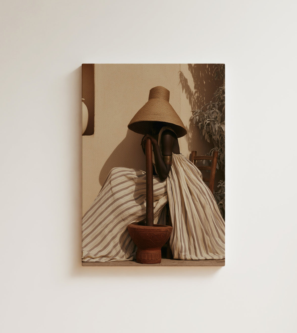 Afternoon at the Mortar: A faceless woman in a striped cream robe leans into a wooden pestle. Canvas wall art, shown on a plain wall