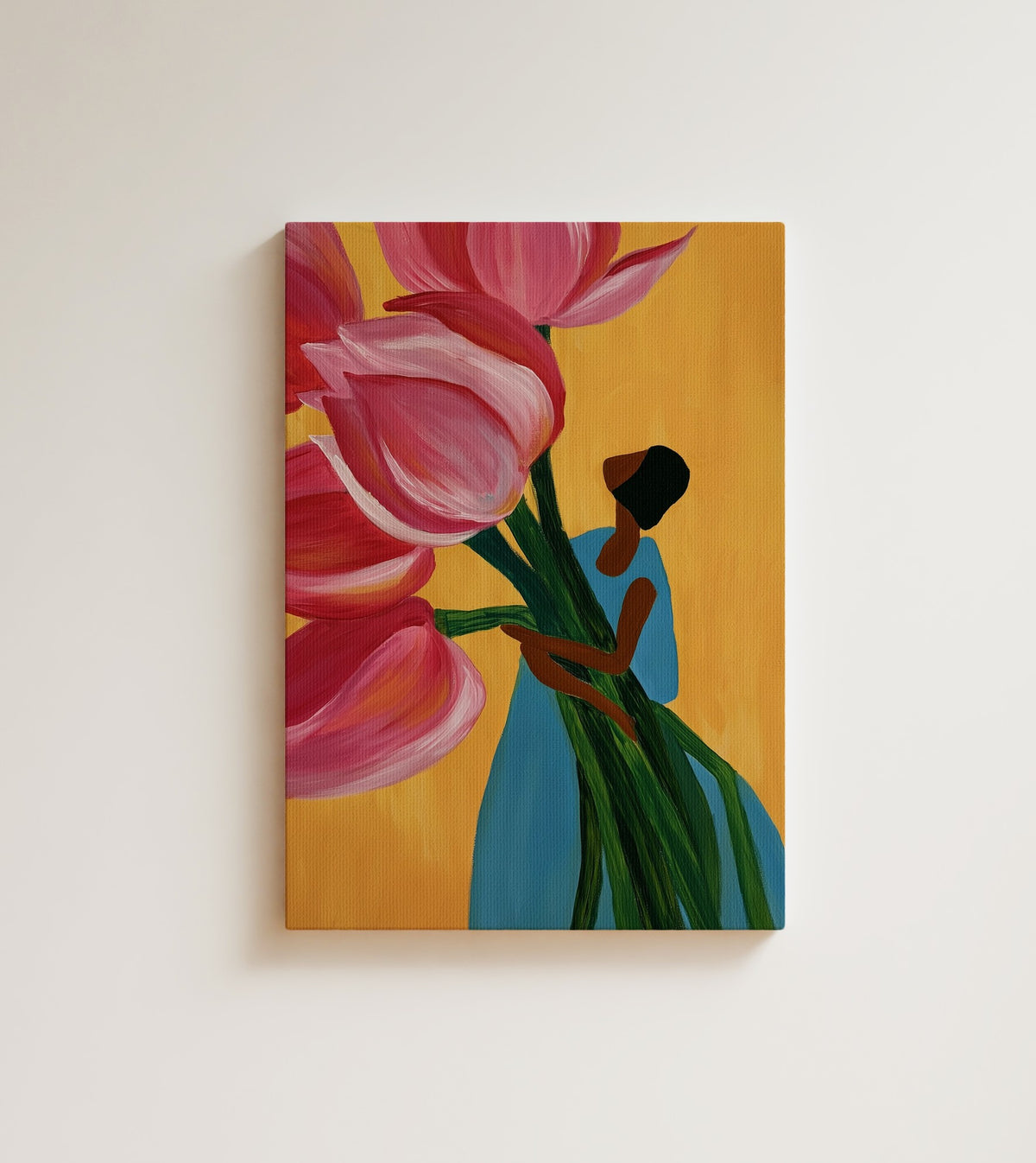 Carrying Spring: A woman in a blue dress, seen from behind. Canvas wall art, shown on a plain wall