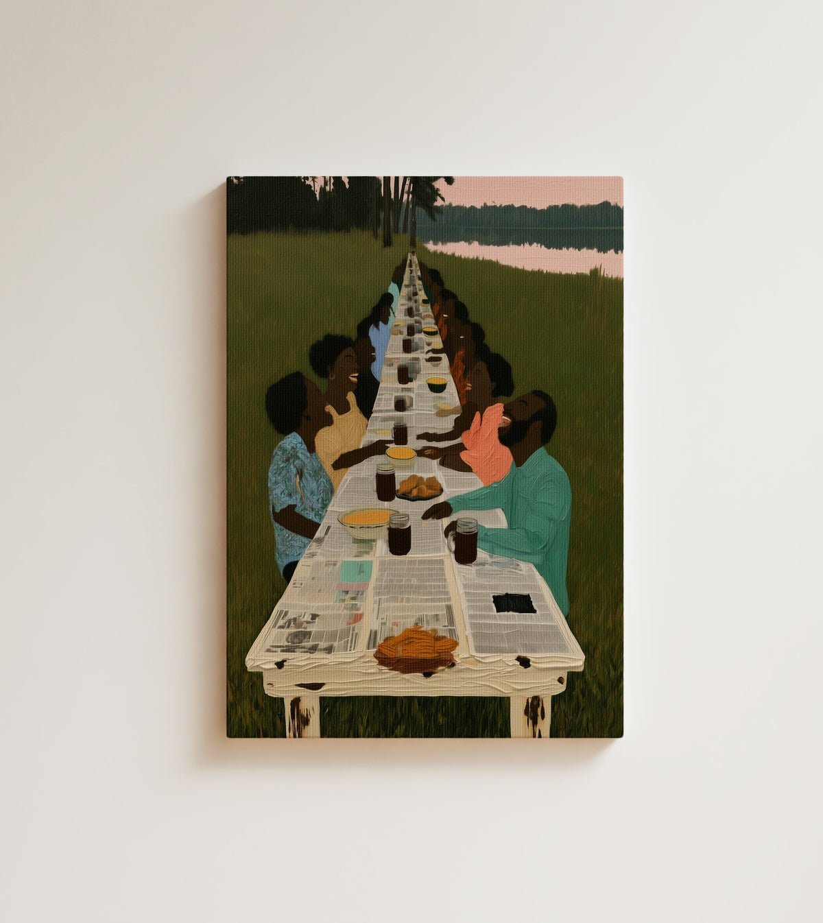 The Long Table: seen from above, a long newspaper-covered table stretches across a green field toward the lake. Canvas wall art, shown on a plain wall