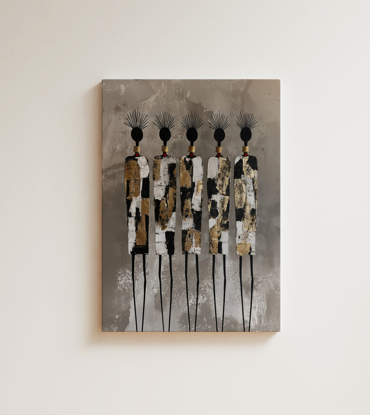 Gilded Rhythm: five tall, slim African figures crowned with feathers, wrapped in gold leaf, black and white. Canvas wall art, shown on a plain wall