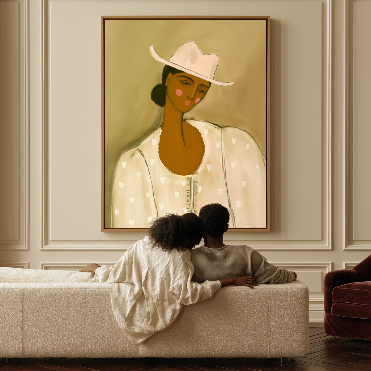Girl in Stetson canvas above a sofa, a couple sitting together