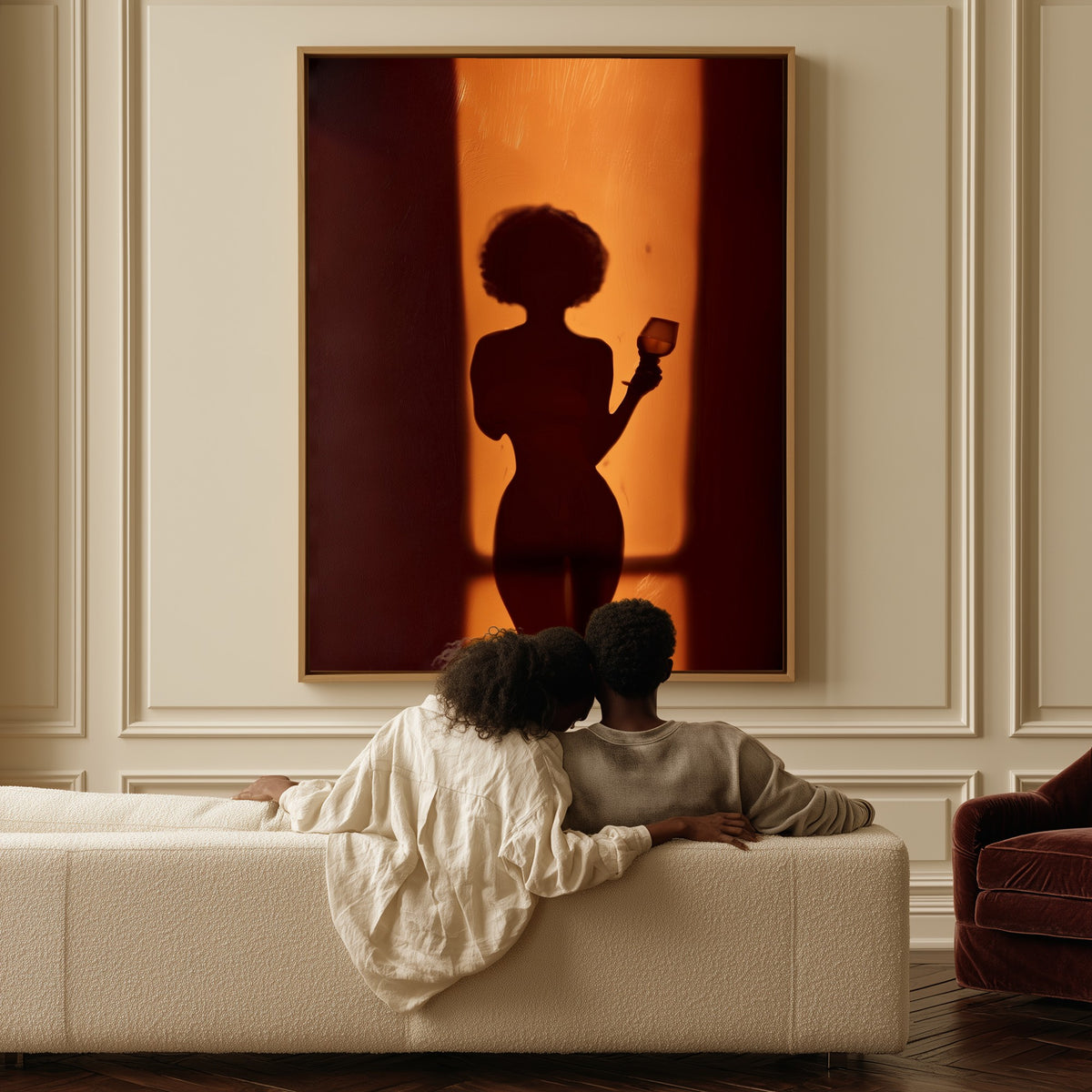 Silhouette at the Door canvas above a sofa, a couple sitting together