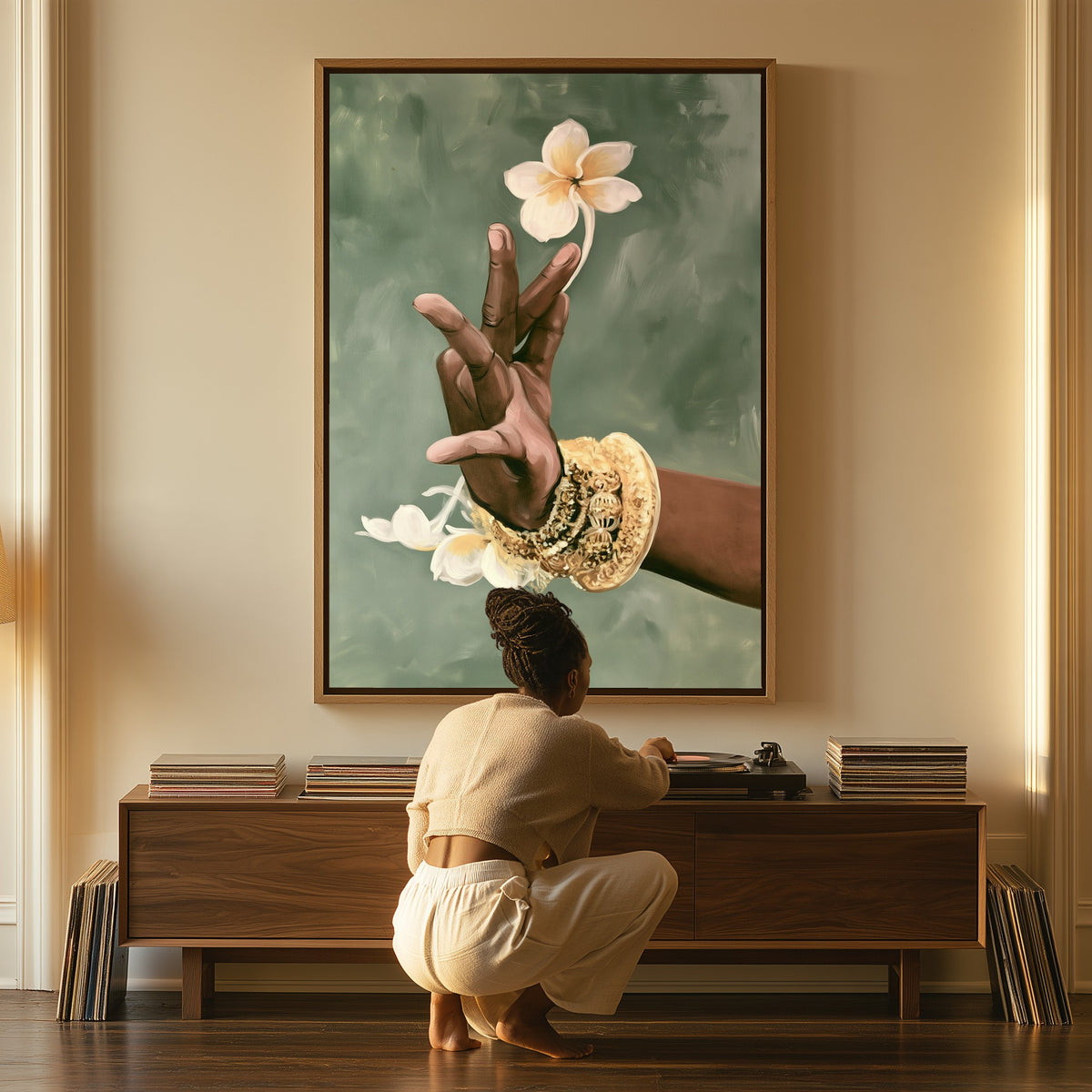 Tender Gesture canvas above a console table, a woman beside it