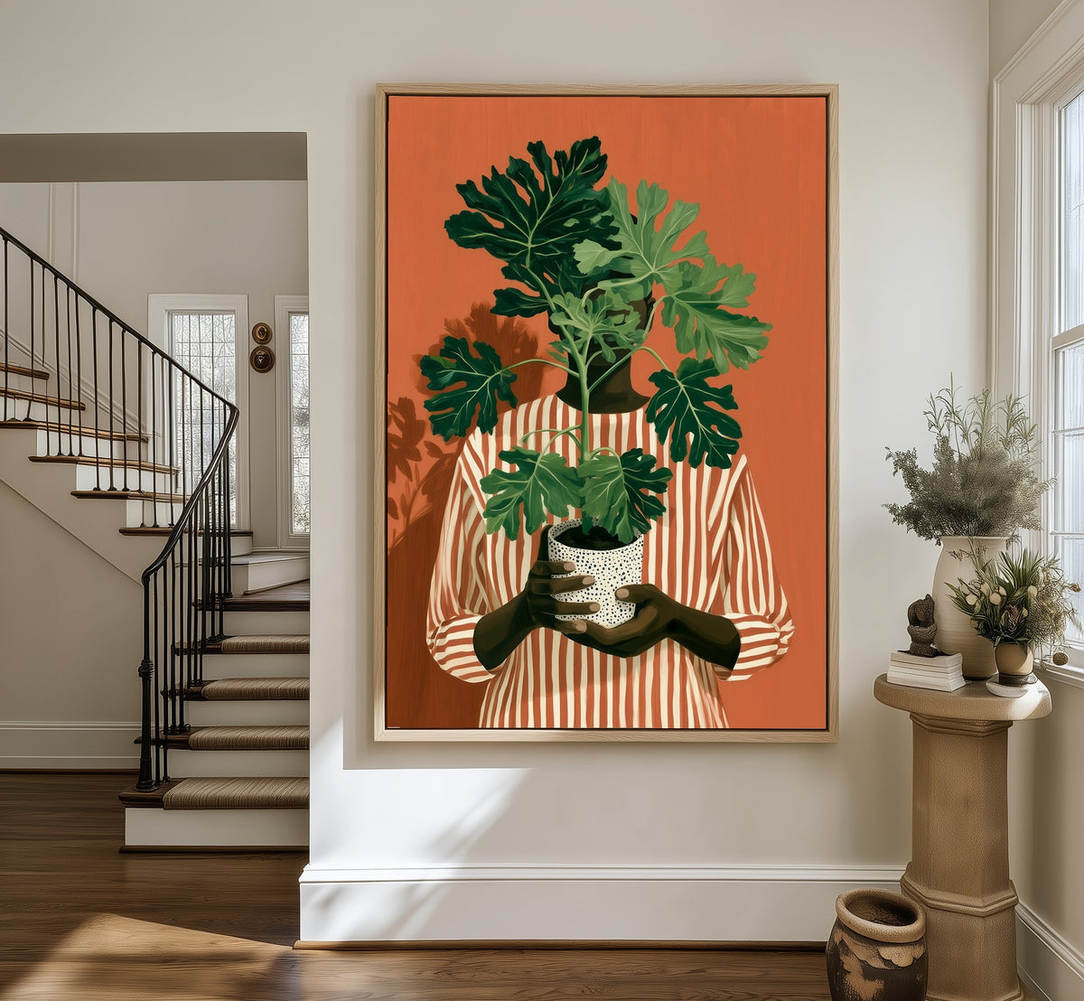 Rooted Warmth framed canvas in an entryway by the stairs