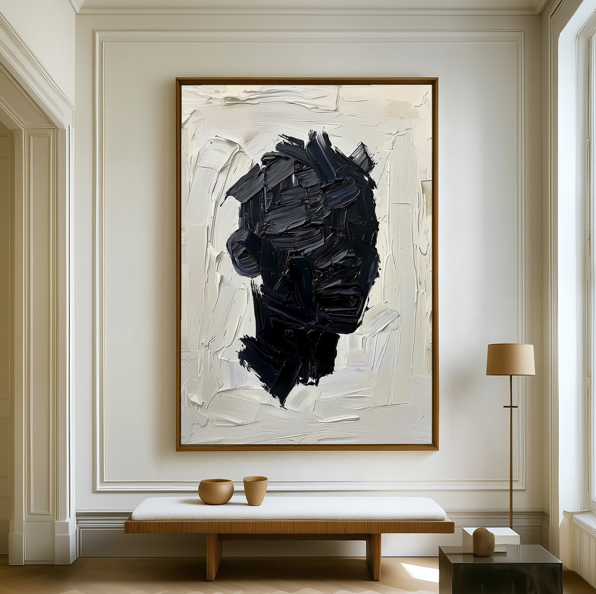 Unfinished Self canvas above a walnut bench in a bright living room
