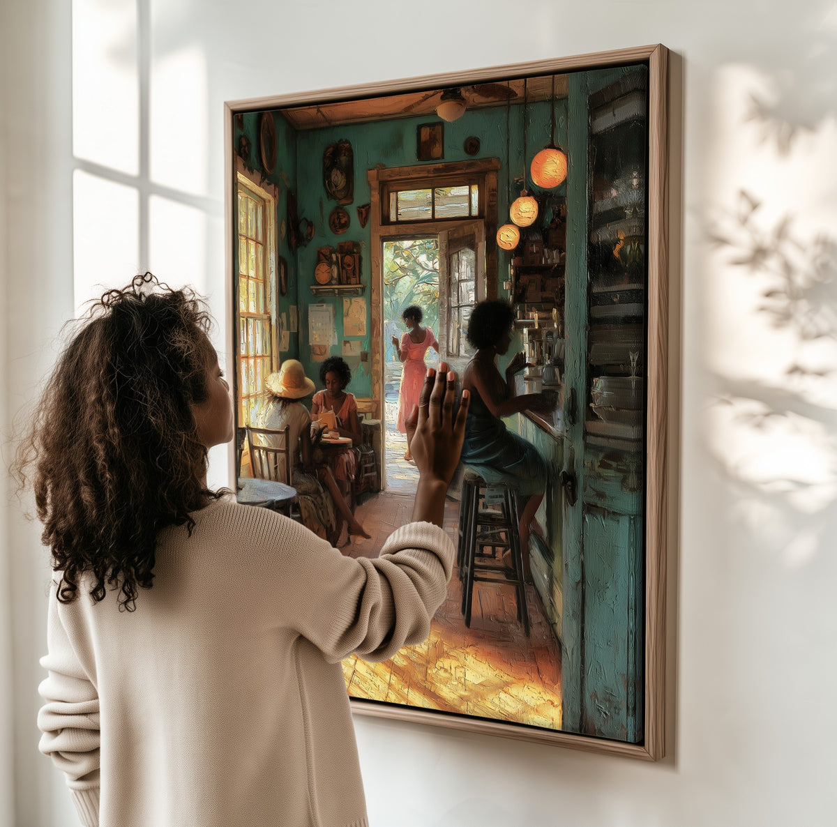 Morning at the Café framed canvas, a woman hanging it on a sunlit wall