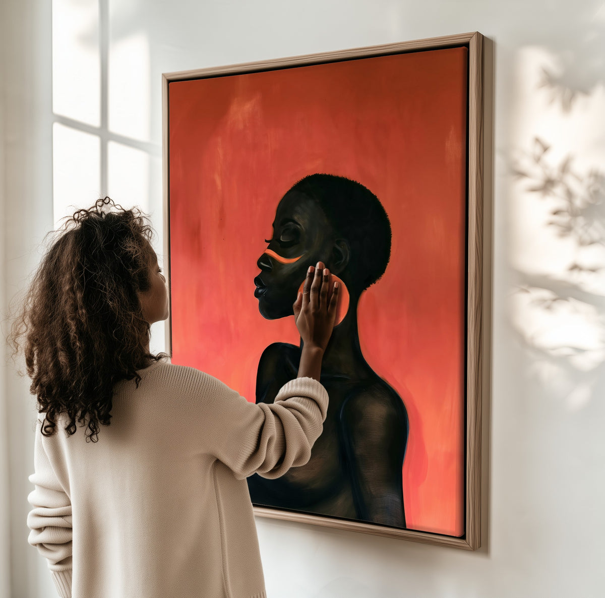 Copper Hoop framed canvas, a woman hanging it on a sunlit wall