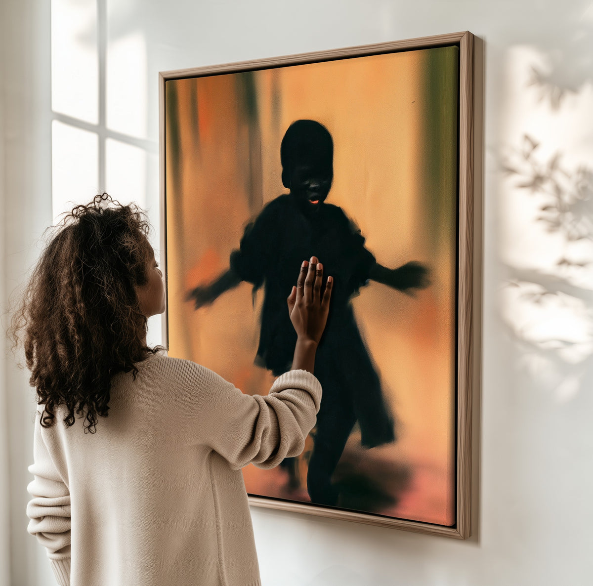Dance in the Hall framed canvas, a woman hanging it on a sunlit wall