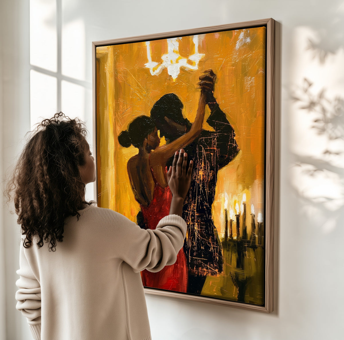 Candlelit Tango framed canvas, a woman hanging it on a sunlit wall