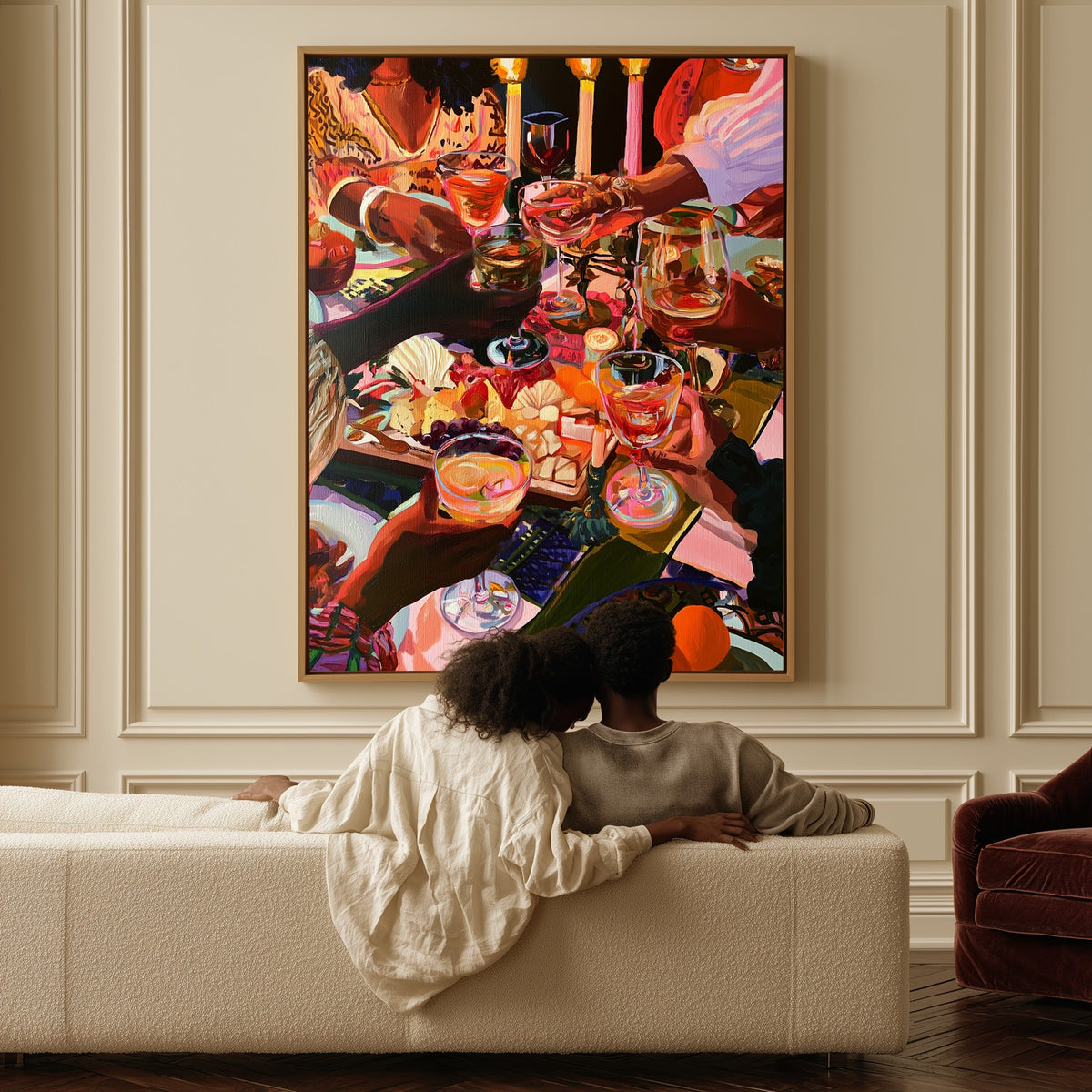Candles and Company canvas above a sofa, a couple sitting together