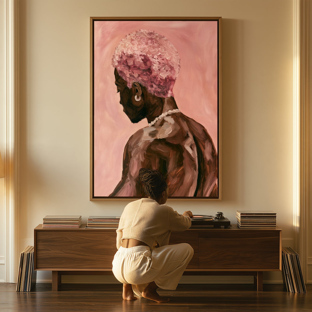 Man with Pink Blossoms canvas above a console table, a woman beside it