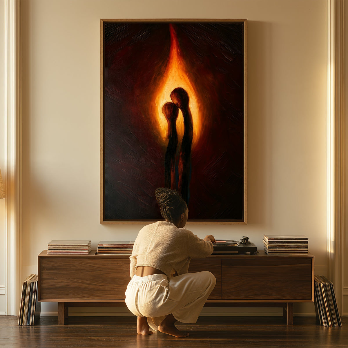 One Flame canvas above a console table, a woman beside it
