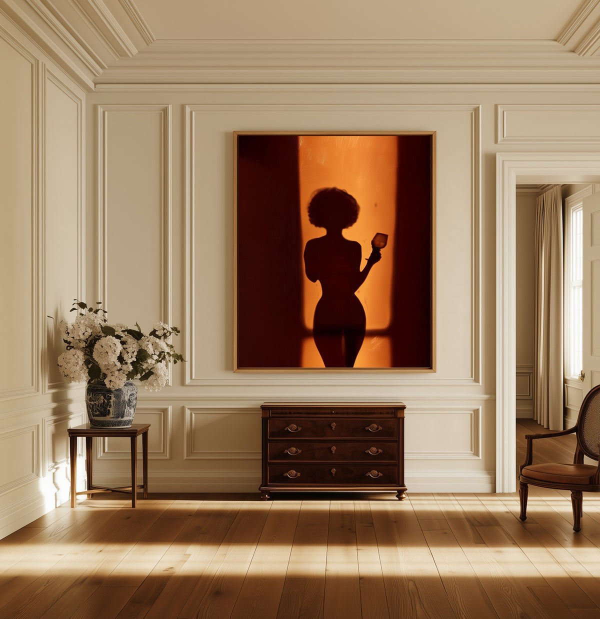 Silhouette at the Door canvas above a dark wood chest in a hallway