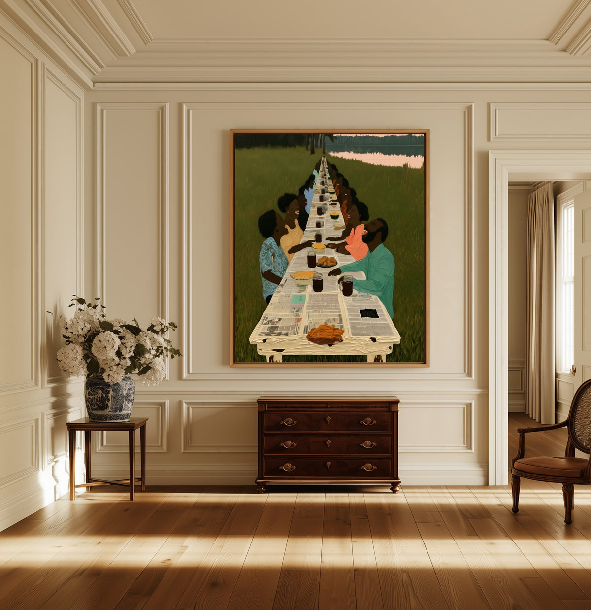 The Long Table canvas above a dark wood chest in a hallway