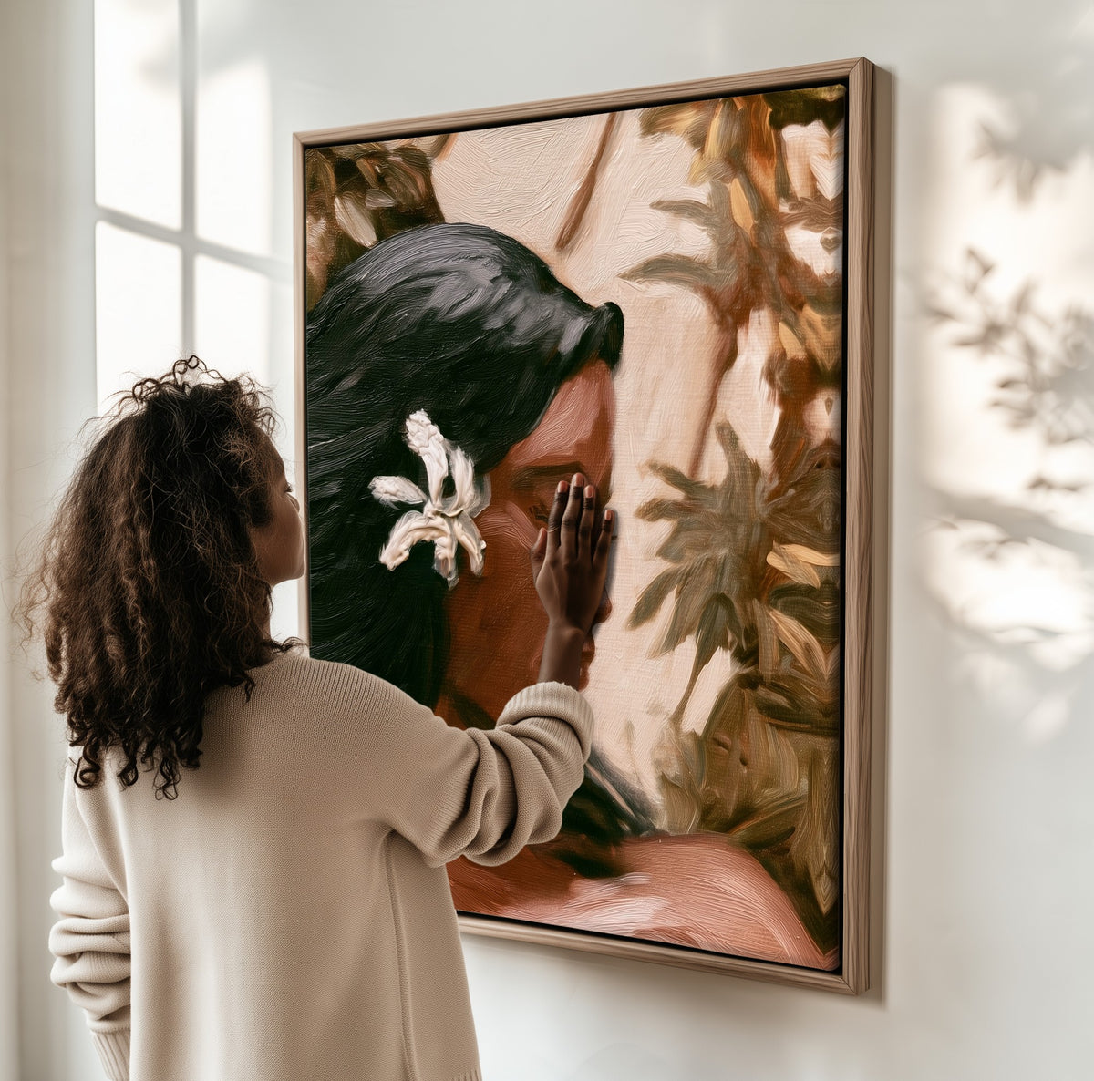 Woman with a Frangipani framed canvas, a woman hanging it on a sunlit wall