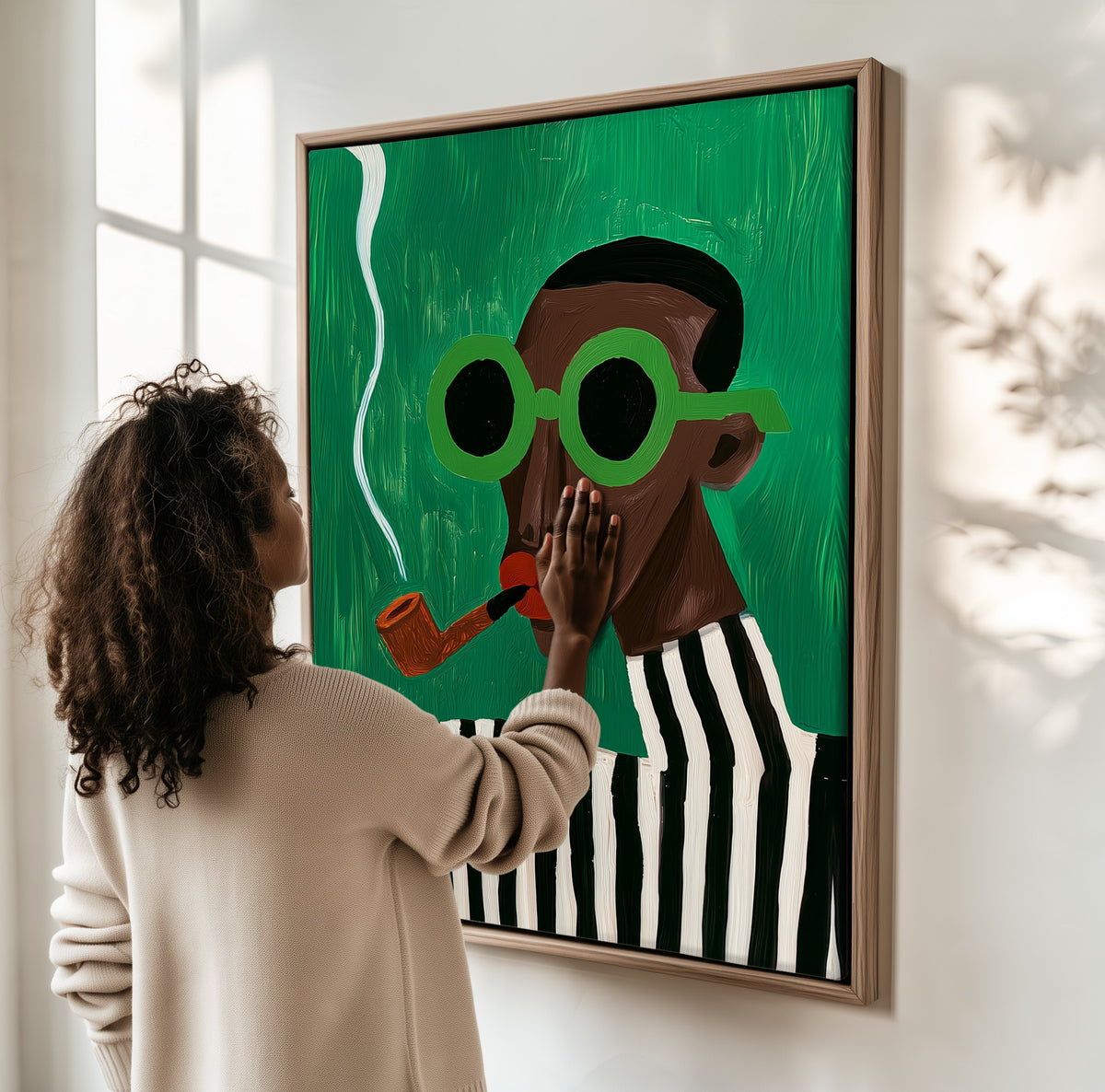 Slow Smoke framed canvas, a woman hanging it on a sunlit wall